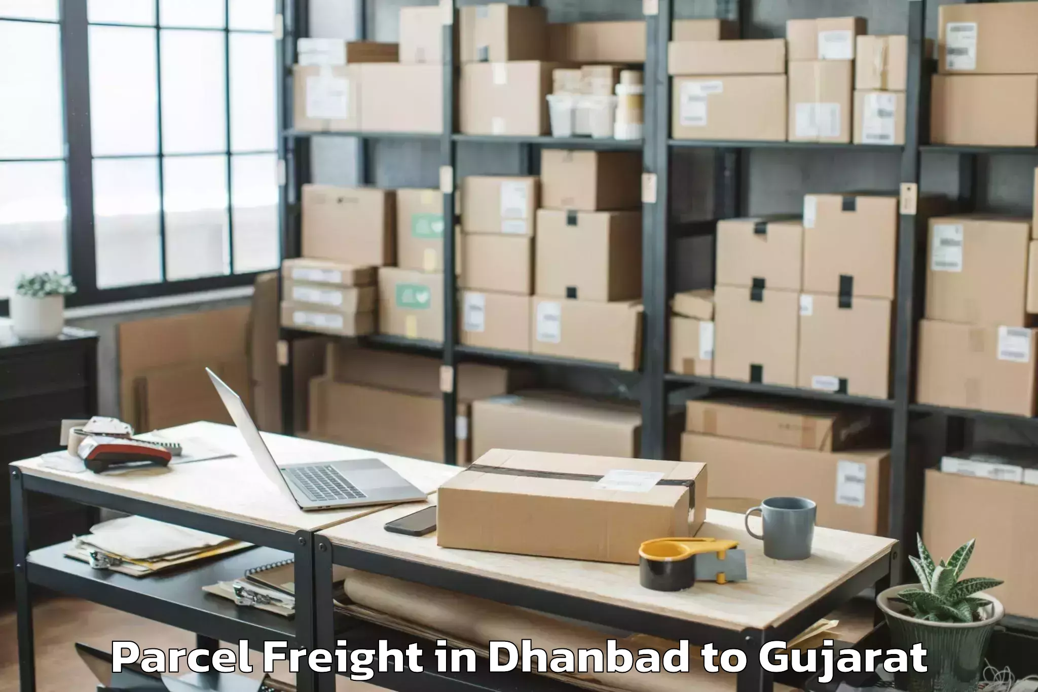 Top Dhanbad to Kodinar Parcel Freight Available